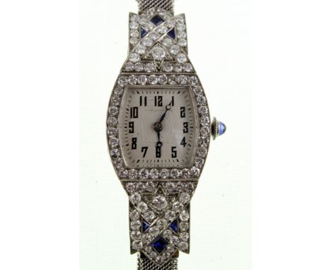 A 1920's platinum, diamond and sapphire set cocktail watch with fitted 9ct white gold bracelet, approx total diamond weight 2