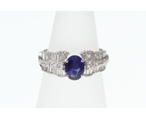 An 18ct H/M sapphire and diamond cluster ring, size J