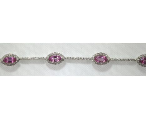 An 18ct H/M pink sapphire and diamond set bracelet, approx total diamond weight 1.50ct