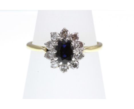 A Sapphire and Diamond cluster ring stamped 18ct, size L-M   [VAT included in hammer price on this lot - this does not affect