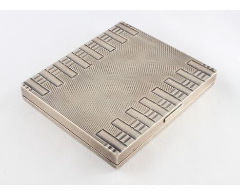 An Art Deco white metal compact with French marks, gross weight approx 