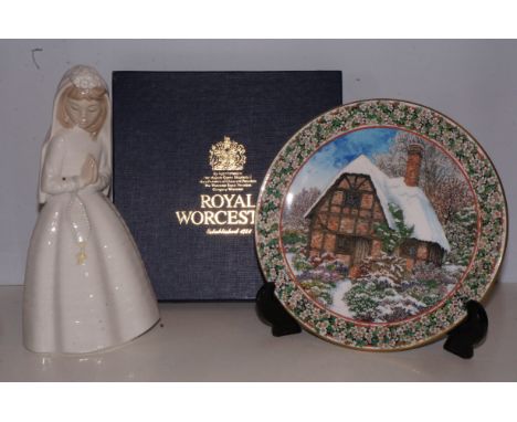 Royal Worcester Christmas plate together with a Nao figure