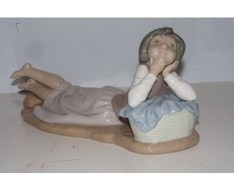 Nao figure of a girl laying down Length 30 cm 