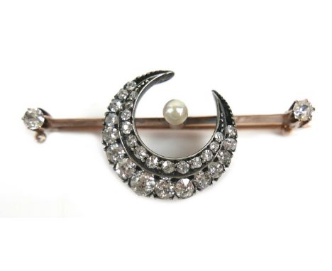 A Victorian yellow metal brooch, formed as a crescent set with rows of diamonds on a knife edge bar, and centred by a pearl, 