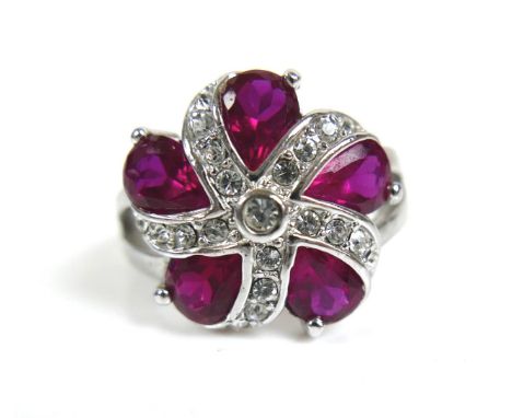 A white metal ruby type spiral cluster ring, size P/Q, 6.6g. 