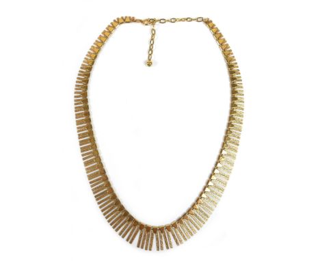 A 9ct yellow gold vintage design fringe necklace, with bark effect, FEU Ld, 20mm at widest, 45cm long, 28.1g, in burgundy pla