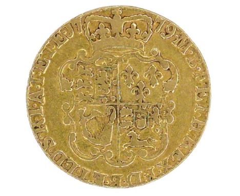 A George III gold guinea, 1779, obverse with fourth laureate portrait of King George III right, reverse with quartered shield
