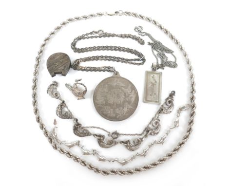 A small group of silver jewellery, including a twelve days of Christmas medallion, 45mm, a double twist chain, a pendant, a m