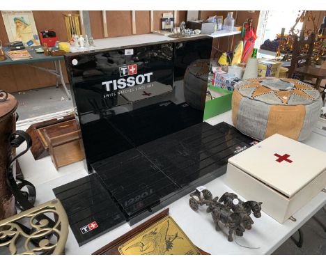 A TISSOT WATCH DISPLAY STAND 