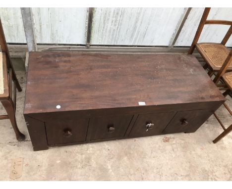 AN INDONESIAN WOOD COFFEE TABLE WITH FOUR DRAWERS 