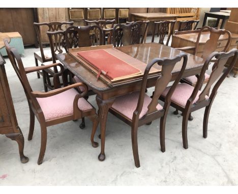 A WALNUT DINING TABLE ON CABRIOLE SUPPORTS WITH EXTRA LEAF WITH FOUR CHAIRS AND TWO CARVERS 