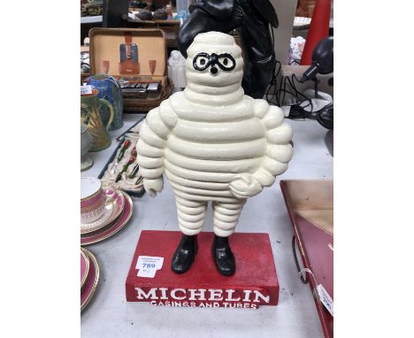 A CAST IRON MICHELIN MAN MODEL 