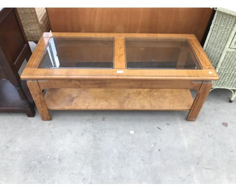 A MAHOGANY COFFEE TABLE WITH GLASS PANEL TOP 