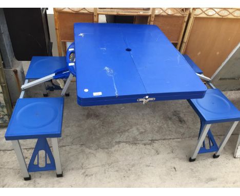 A FOLDING FOUR SEAT PICNIC TABLE 