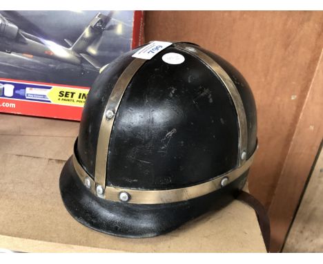 A VINTAGE METAL MOTORCYCLE HELMET 