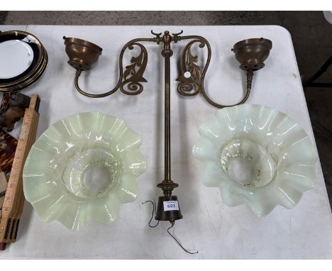 AN ANTIQUE LIGHT FIXTURE WITH TWO VASELINE GLASS SHADES 