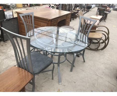 A METAL PATIO TABLE WITH GLASS TOP AND THREE MATCHING CHAIRS 