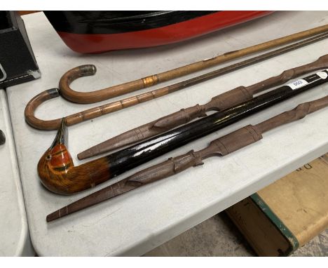 TWO WOODEN SPEARS AND BIRD DESIGN HANDLED WALKING STICK 