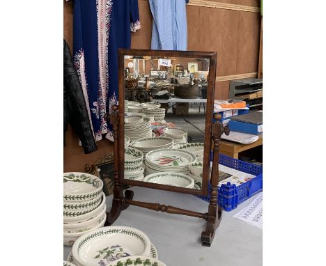 A WOODEN DRESSING TABLE MIRROR 