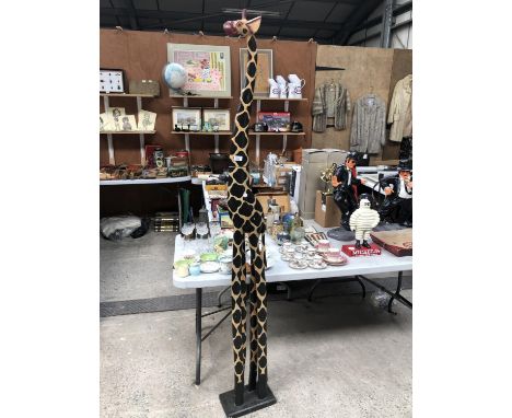 A LARGE WOODEN MODEL OF A GIRAFFE 