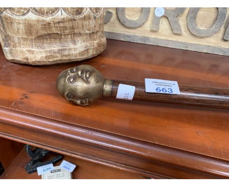 A BRASS FOUR FACED BUDDHA WALKING STICK 