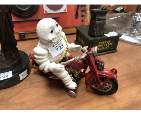 A CAST METAL MICHELIN MAN ON BIKE MODEL 