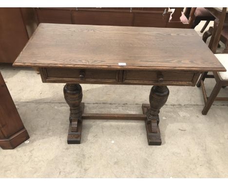 AN OAK HALL TABLE WITH TWO DRAWERS 