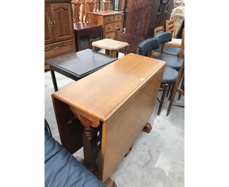 AN OAK DROP LEAF DINING TABLE 