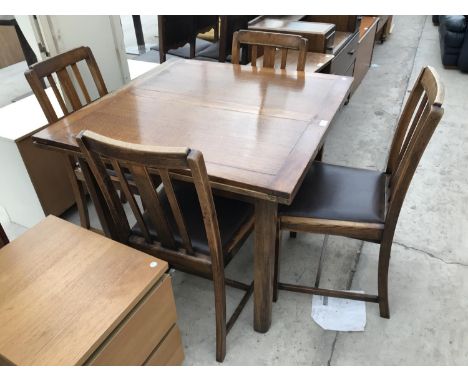 AN OAK DRAW LEAF DINING TABLE AND FOUR OAK DINING CHAIRS 