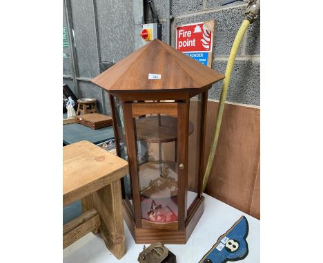 A HEXAGONAL TABLE TOP DISPLAY CABINET 