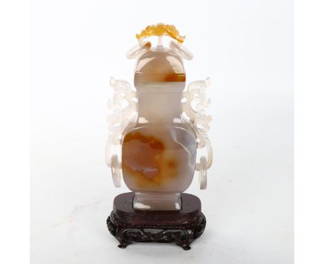 A Chinese jade/agate square-section vase and cover, carved from a single piece of hardstone, with integral pierced and scroll