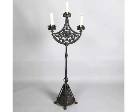 Boris Karloff, a Gothic style wrought-iron floor standing 3-branch lamp, with pierced metal panels inset, overall height 140c