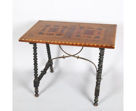 A Spanish stretcher table, walnut tortoiseshell and boxwood inlay, on ebonised bobbin turned supports and wrought-iron stretc