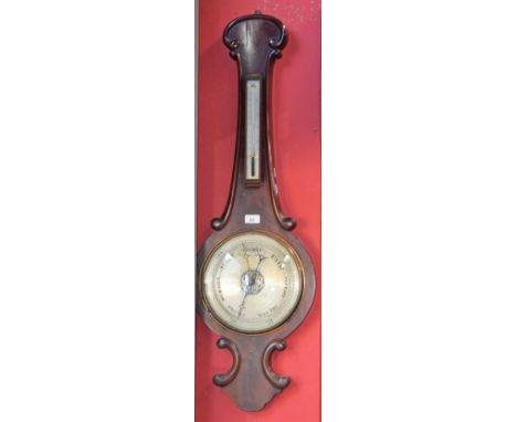 A Victorian mahogany wheel barometer, 24cm silvered register, alcohol thermometer, the flame veneered case outlined with C-sc