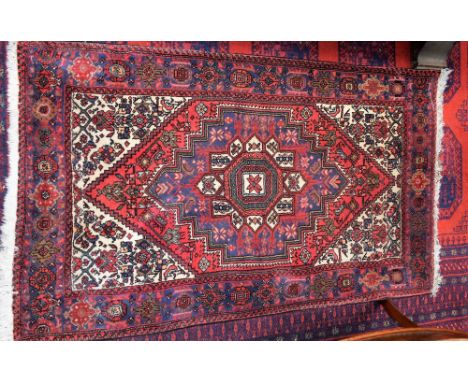 A Middle Eastern woollen carpet, 133cm x 78cm