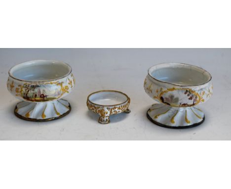 A pair of South Staffordshire enamel  pedestal salts, enamelled with rural scenes within raised scroll cartouches, spiralled 