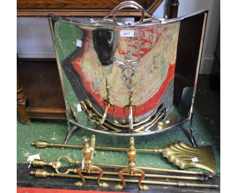 An Art Deco chromed firescreen, with winged torch crest; a five piece companion set, tongs, shovel, poker and andirons (6)