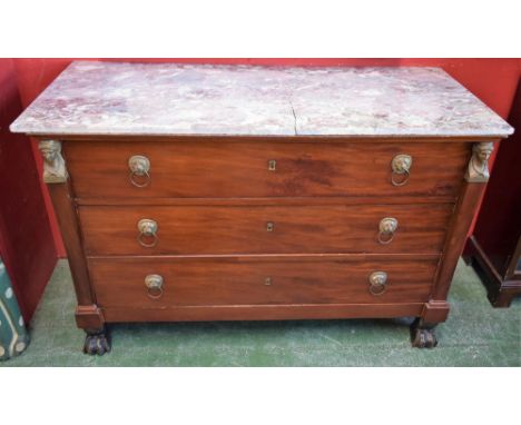 A 19th century mahogany commode, in the manner of Bernard Molitor, rectangular marble top above three long drawers flanked by