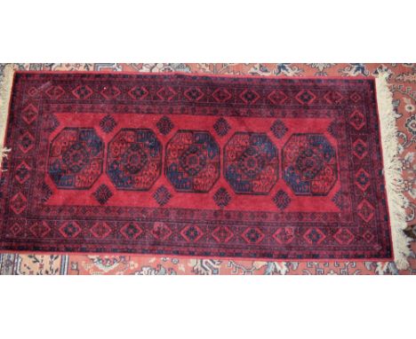 A Middle Eastern carpet, bears label for Tabris-Super, 90cm x 180cm