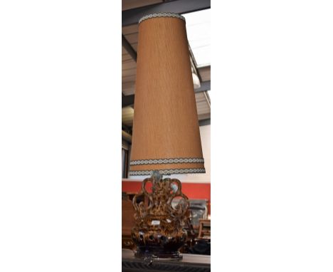 A large West German twin handled lamp, tones of brown, lava type glaze, original hessian covered shade