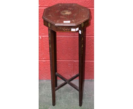 An early 20th century mahogany kettle/jardiniere stand, octagonal top painted with flowers and bell husks centred by a portra