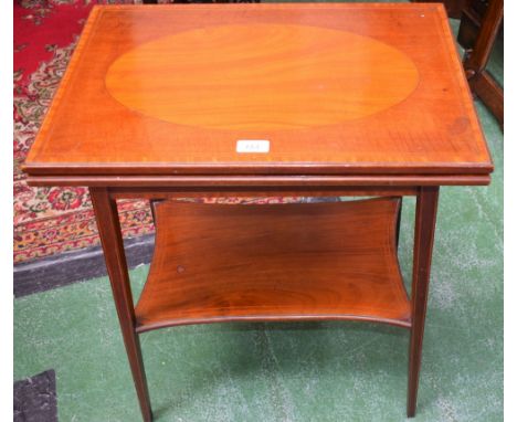 An Edwardian mahogany patience/card table, hinged rectangular top enclosing a baize lined playing surface, incurved rectangul