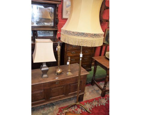 Lighting - a 1930's telescopic brass standard lamp, twist lock collar, tripod base; a brass table lamp; etc (4)