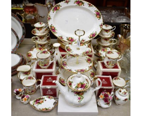 A Royal Albert Old Country Roses pattern dinner and tea service, comprising teapot, milk jug, sugar bowl, cups, saucers, two 