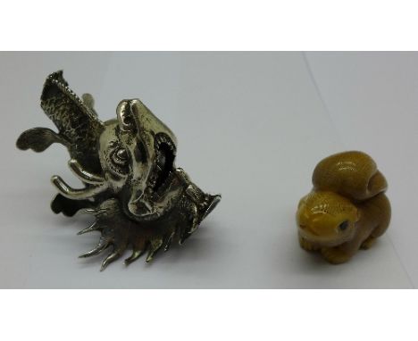 A squirrel netsuke and a white metal dragon's head, a/f