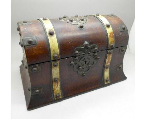 A walnut caddy with domed top