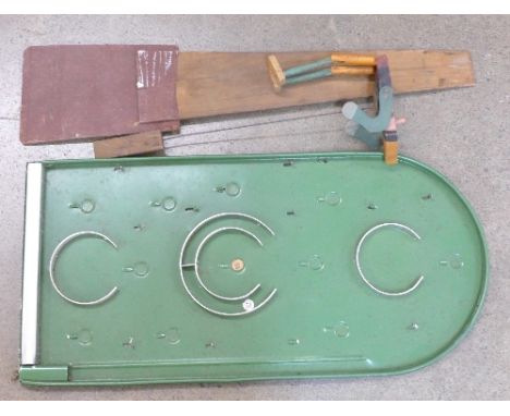 A Pinocchio painted puppet and a bagatelle board