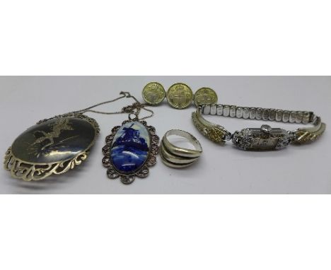 A sterling Niello brooch, a Delft pendant, a lady's sterling watch, a coin brooch and a ring