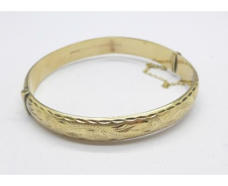 A 9ct gold bangle, 10.5g, a/f, (one dent)