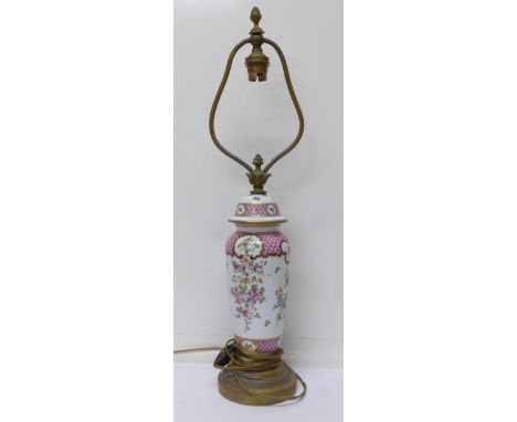 A French decorated porcelain table lamp, height of base 25cm
